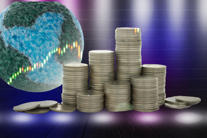 Stacks of coins with a globe and stock graph in the background.